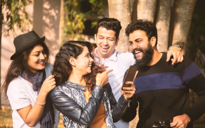 cheerful-friends-talking-while-standing-outdoors_1048944-14046373